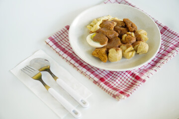 Batagor or better known as bakso, fried tofu, is a typical snack from Bandung, Indonesia. This food is served with peanut sauce and sweet soy sauce plus lime juice.