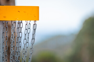 yellow disc golf basket in portugal