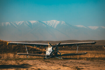 Abandoned aircraft field wirn AN-2 on it