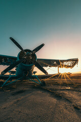 Abandoned aircraft field wirn AN-2 on it