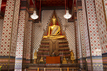 Golden Buddha Statue is in a temple.
