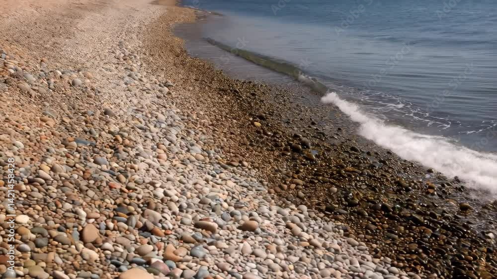 Poster serene ocean wave gently lapping on a pebbled shore beach