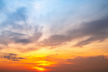 Obraz premium Beautiful , luxury soft gradient orange gold clouds and sunlight on the blue sky perfect for the background, take in evening,Twilight, Large size, high definition landscape photo