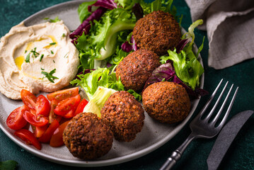 Salad with hummus, falafel and vegetables