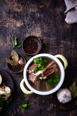 Boiled bone broth or bouillon with meat