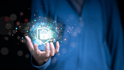 The concept of network cyber security, computer and data protection, with a businessman holding a shield.