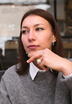 Captivating Contemplation, Woman Holding Cigarette in Bar