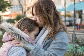 Obraz premium Loving family. Playful child girl and happy mother, outdoors portrait