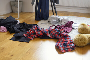 Showing mess in a teenage girls bedroom