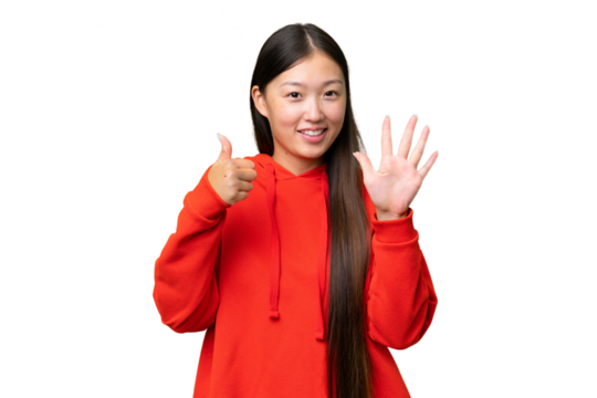 Young Asian woman over isolated background extending hands to the side for inviting to come