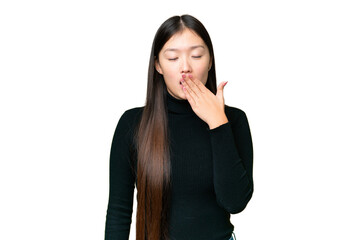 Fototapeta premium Young Asian woman over isolated chroma key background yawning and covering wide open mouth with hand