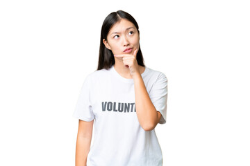 Young volunteer woman over isolated chroma key background having doubts