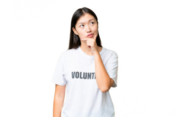 Young volunteer woman over isolated chroma key background having doubts