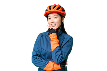 Young cyclist woman over isolated chroma key background smiling