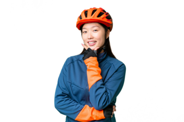 Young cyclist woman over isolated chroma key background smiling