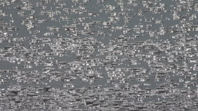 Process of formation of self-setting salt. Salt is deposited at bottom of very salty reservoir, 60 ppm more, on surface there is hypersalted water, rose brine. Sun's rays play in water and crystals