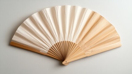 A modern folding fan beautifully presented with soft tones that highlights its artistic design, merging functionality with aesthetic appeal in contemporary decor.