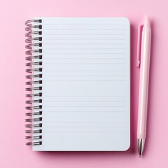 Minimalist notepad and pen on pink surface.