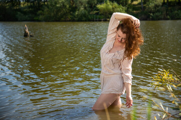 Mature woman enjoying a summer afternoon by the river