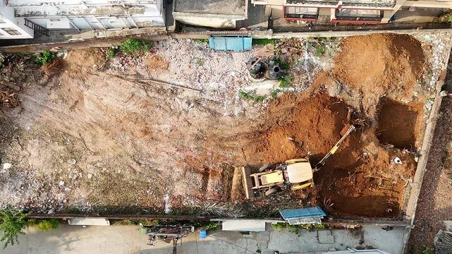 backhoe loader working on a field