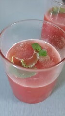 Refreshing watermelon juice served chilled with ice and mint. Vibrant, juicy, and perfect to beat the heat—this summer cooler is a burst of freshness in every sip!