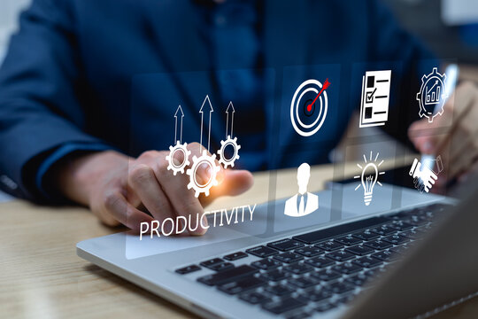 Productivity process concept, businessman using laptop with productivity icon for efficient and effective industrial management, lean cost and productivity growth.