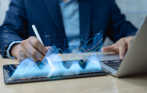 Sales data analysis and business strategy insights on market growth, finance and investment concept, businessman using tablet to analyze market, financial charts and business strategy.