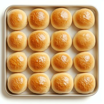 Freshly baked dinner rolls in a tray.