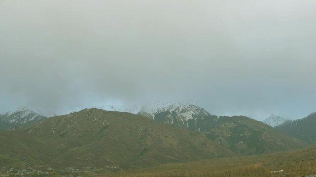 Scenic Timelapse of Cloudy Dawn in Mountainous Region