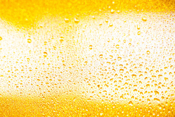 background texture for background bright orange, yellow, sunny color, peach color with shimmering elements and flowing drops on glass, beautiful bright background with overflows and gradient