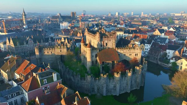 Ghent medieval castle in Belgium, drone shot of historic Ghent city centre at sunrise, Ghent Castle of Counts, Belgian tourist landmark