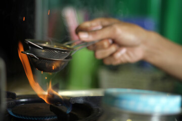 bartender pouring a cocktail