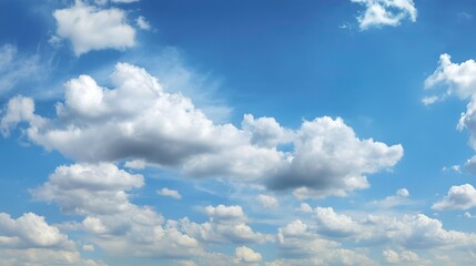 Obraz premium Beautiful clear blue sky with white clouds in background, suitable for nature landscape in summer, spring or autumn on sunny day. Ample 2/3 space for text.