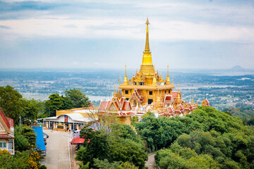 Wat Khiriwong, the highlight is the Ubosot and Phra Chulamani Chedi, located on the top of Khao...