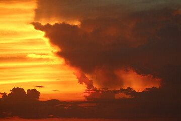 Dramatic Sunset Colors with Golden Light and Dark Cloud Formations