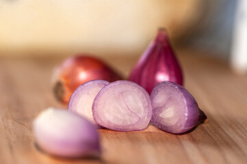 Close-Up View of Sliced Red Shallots on a Wooden Table Surface