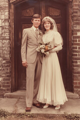 vintage wedding portrait photo of bride and groom 70s - 80s full length in doorway