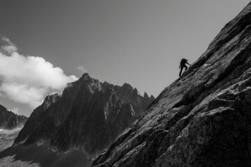 single climber expertly navigates steep rugged mountain face reaching for new heights with determination