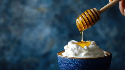 Delicate honey drizzle over creamy dessert, enhanced visual appeal and textures