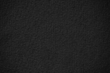 abstract texture of black poster. dark paper background with vignette