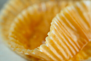 backing paper for fresh muffins, close up shot with narrow depth of field.Food,cakes,baking,sweets concept.