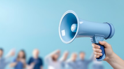 Hand with blue megaphone addresses large crowd communication and public speaking