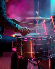 Dynamic drum set performance on stage with vibrant lights, representing musical energy and rhythm. Ideal for concert promotions, music blogs, and entertainment industry visuals.