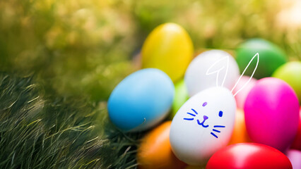 multicolor Easter eggs, blurred meadow flowers in an affectionate moment, blurred green grass 