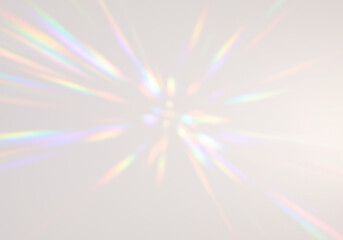 Starburst light patterns with vibrant rainbow refractions explode outwards from the centre on transparent background