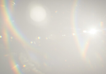 Soft lens flares and rainbow streaks with scattered light sources, ethereal effect on transparent background