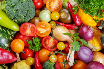 mix of fresh vegetables as background, top view