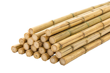 Stacks of bamboo poles ready for construction in a garden setting during daylight hours