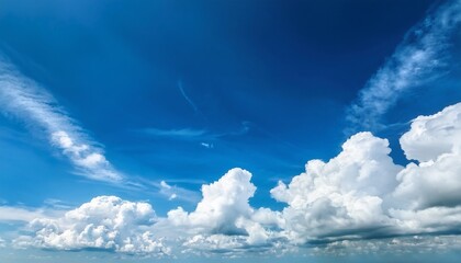 Blue nature day with white fluffy clouds in the clear blue sky