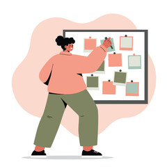 Woman organizing sticky notes on board with pink and green colors in casual outfit standing indoors 